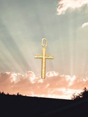 An authentic 14K solid yellow gold minimalist cross